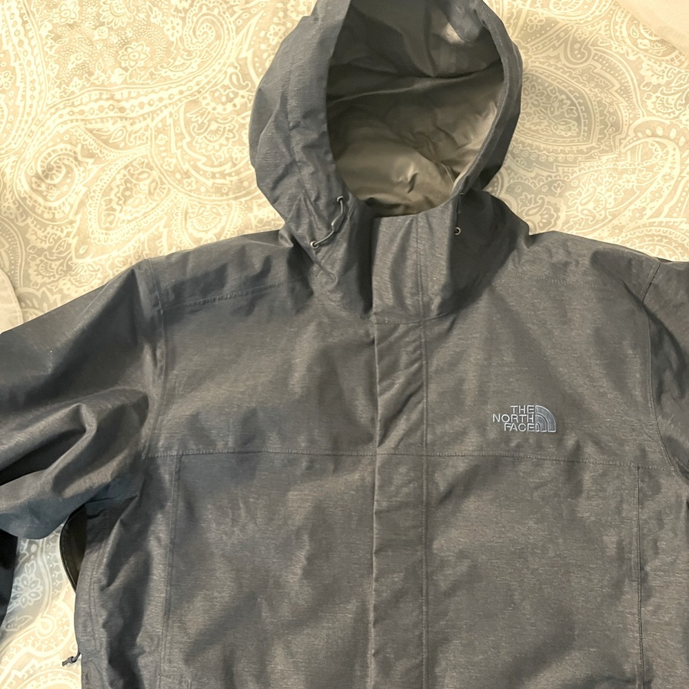 Heathered navy North Face rain jacket